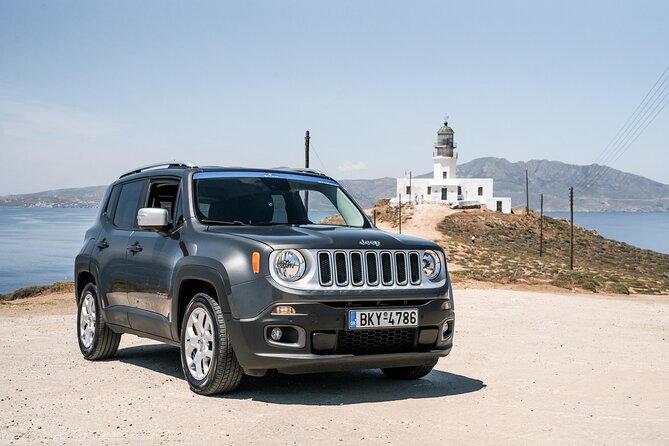 Explore Mykonos with local guide and Jeep Renegade Private Tour - Armenistis Lighthouse: the north-west photo stop with Tinos in view