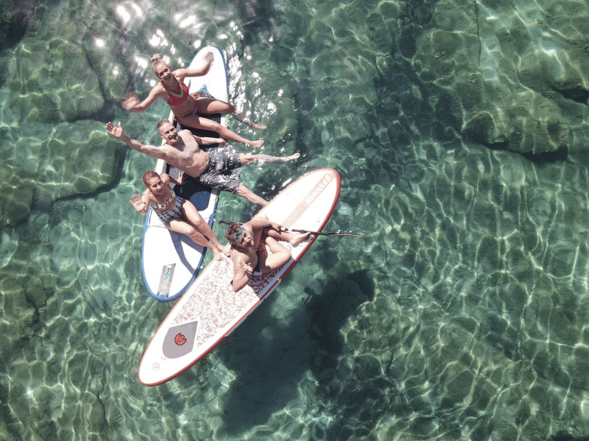 From Ornos: Mykonos Delos Catamaran Cruise with Meal & SUP - Rhenia Island: the stop that makes the half-day worth it