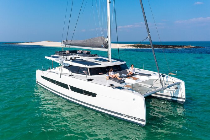 Mykonos: Brand-New Catamaran Cruise with Meal, Drinks & Transport - Delos pass-by: the UNESCO sight without the crowds
