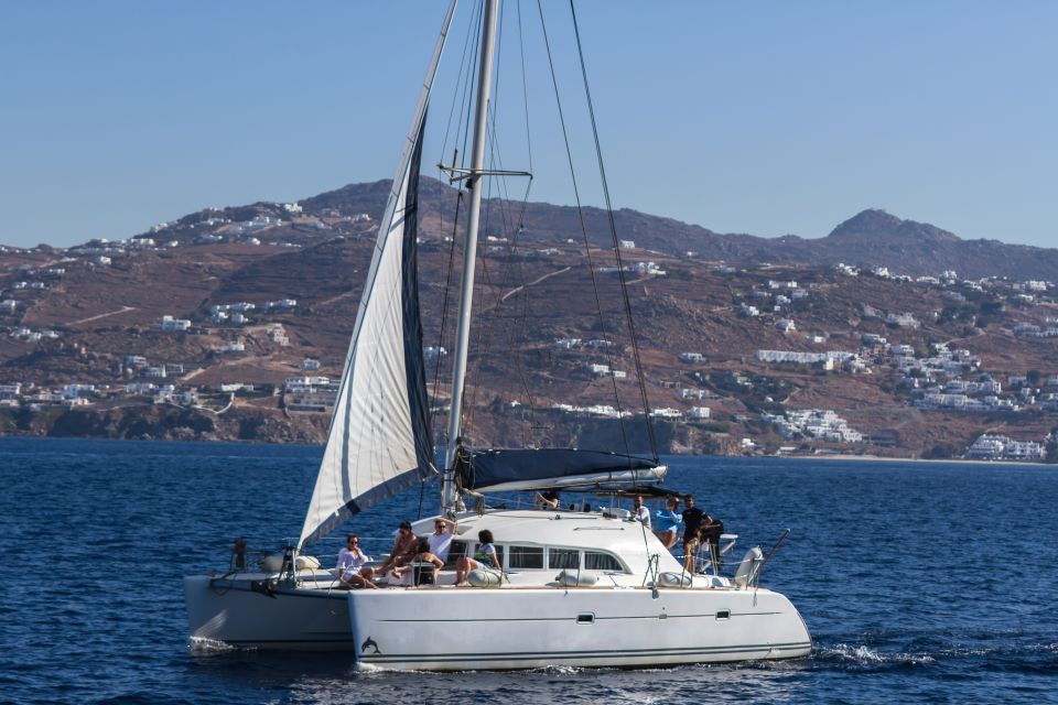 Mykonos: Catamaran Cruise With Meal and Drinks - Hotel Pickup → Modern Catamaran: How the Day Starts Smoothly