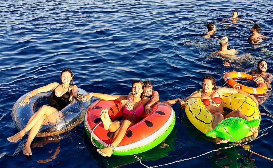 Mykonos: Sunset Boat Party with Open Bar & Live DJ - Swim stops, inflatables, and the jumping board: the fun you earn
